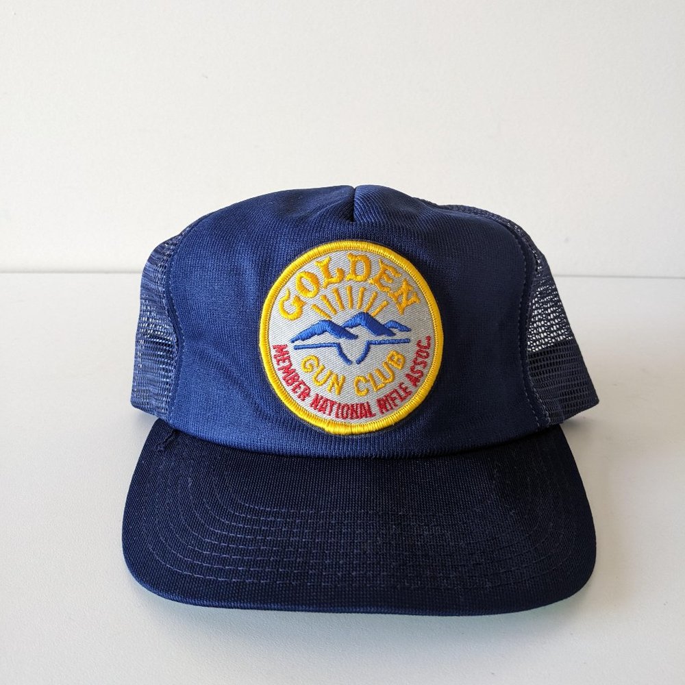 Golden Gun Club trucker hat